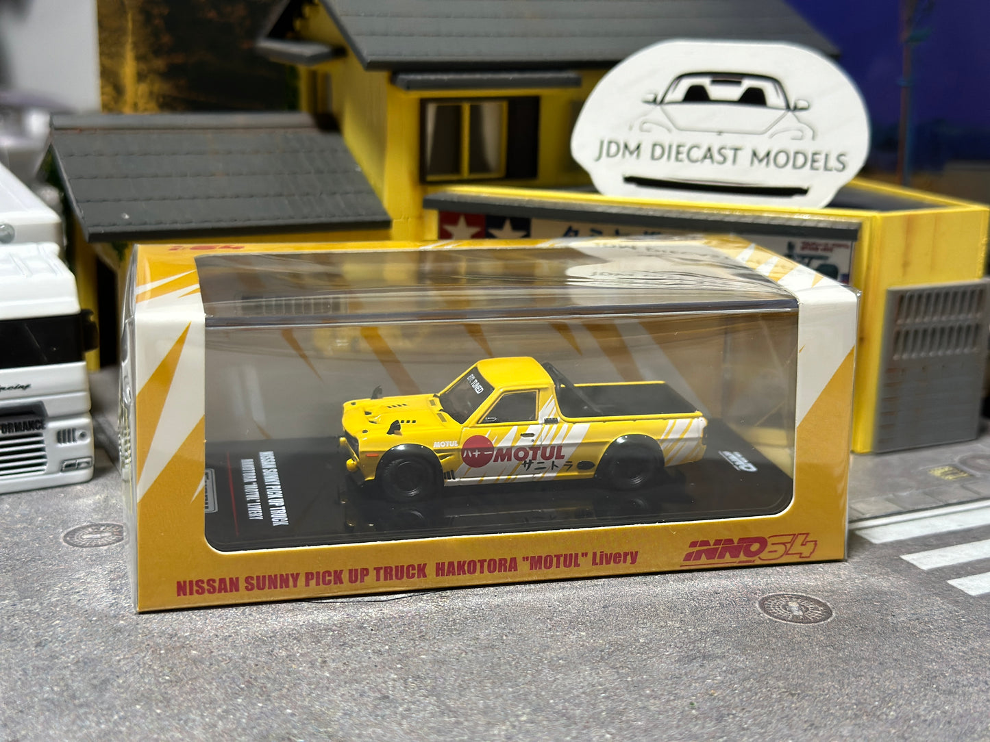 Inno64 Die-Cast Nissan Hakotora Pick Up Truck "MOTUL" Livery